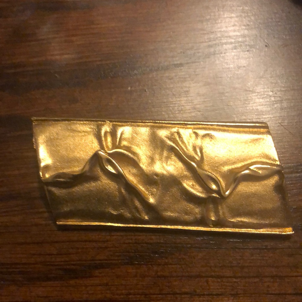 Vintage mattgold with shinny raised design. Sold as is